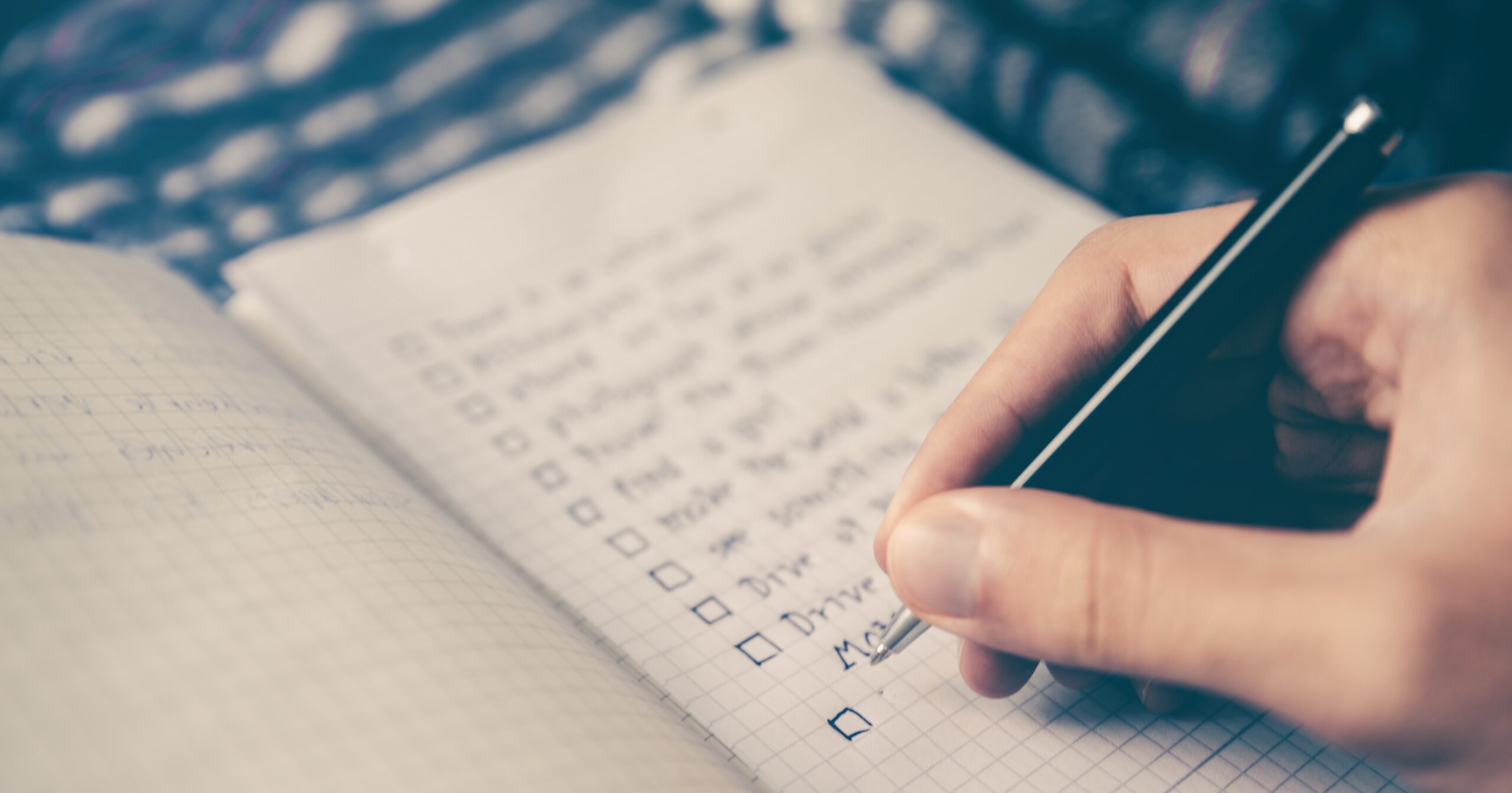 Person writing their checklist for change